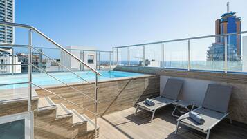 Seasonal outdoor pool, pool umbrellas, sun loungers