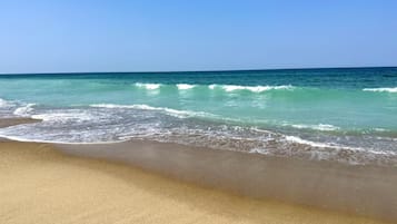 On the beach, sun loungers, beach towels