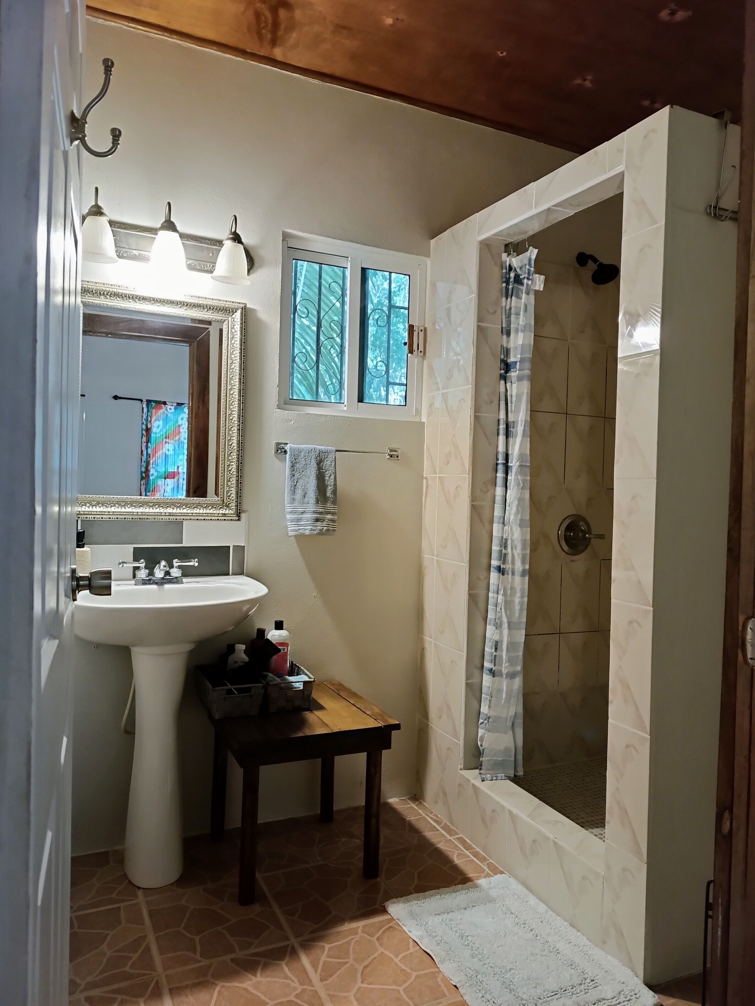 Shower, rainfall showerhead, hair dryer, towels