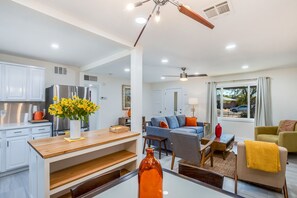 Enjoy a spacious living area with a kitchen, dining space, and cozy seating area.