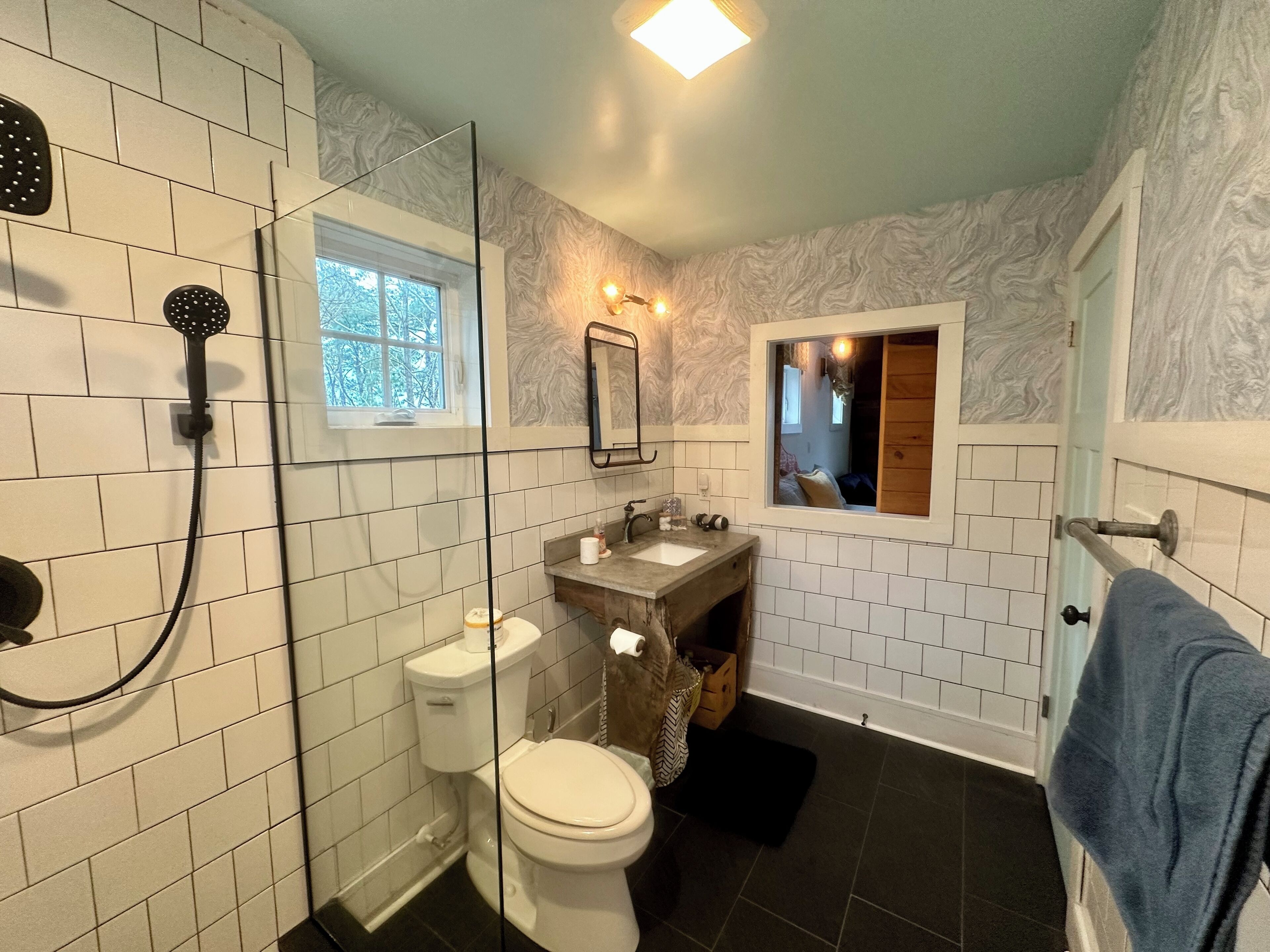 Shower, hair dryer, towels, toilet paper