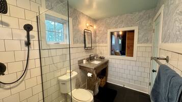 Shower, hair dryer, towels, toilet paper