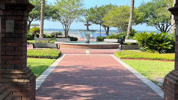 A brick pathway leading to a gazebo with a view of the sea. - Cumberland Queen Cottage (St Marys)