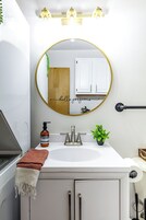 Casa on High | Bathroom | Rainfall showerhead, eco-friendly toiletries, hair dryer, towels