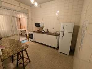 Microwave, stovetop, dining tables