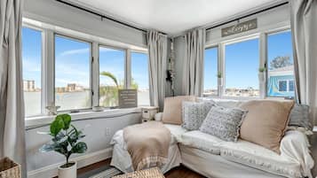 Luxury Studio Suite | Living area | 45-inch Smart TV with digital channels