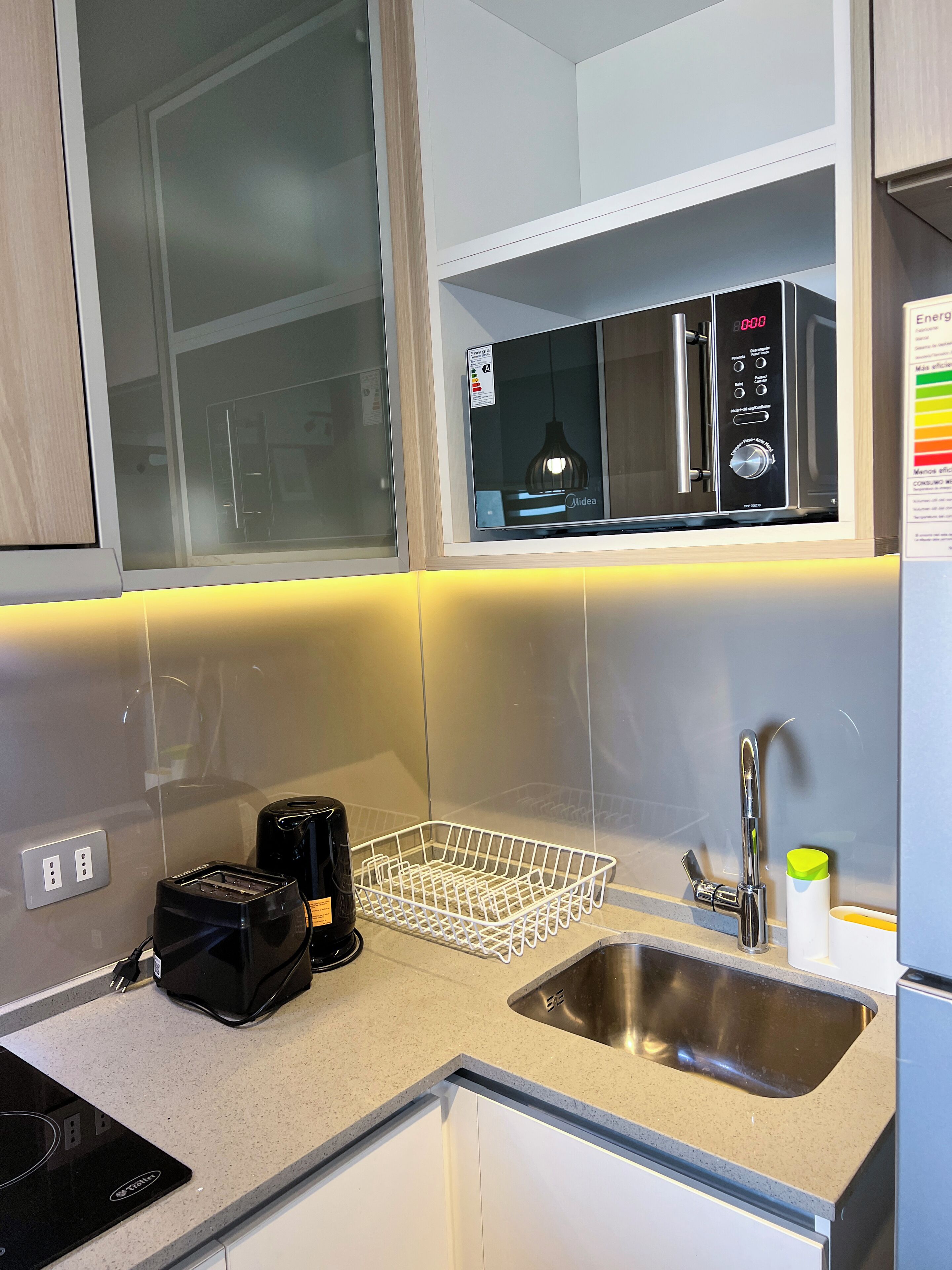 Espresso maker, full-sized fridge, microwave, oven