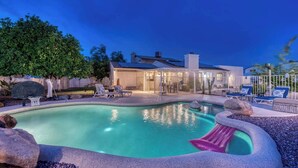 A backyard with a swimming pool, lounge chairs, and a covered patio area. - YOUR private Desert Getaway with FREE Heated Pool! (Phoenix)