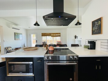 Beautiful kitchen fully stocked with all that you need to make home cooked meals