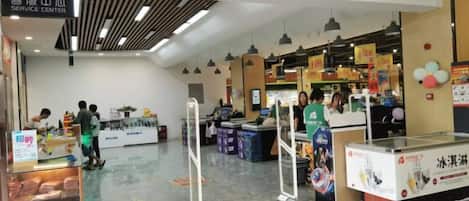 A service center with a clear entrance, a counter area, and a display case with items.