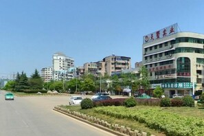 A multi-story building with signage indicating it is a hotel. - Anqing Yingdeli Hotel (Anqing)