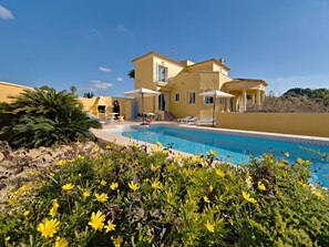A yellow villa with a swimming pool, outdoor seating, and a pergola. - Wonderful private villa for 10 guests with A/C, private pool, WIFI, TV, terrace and pets allowed (Benissa)