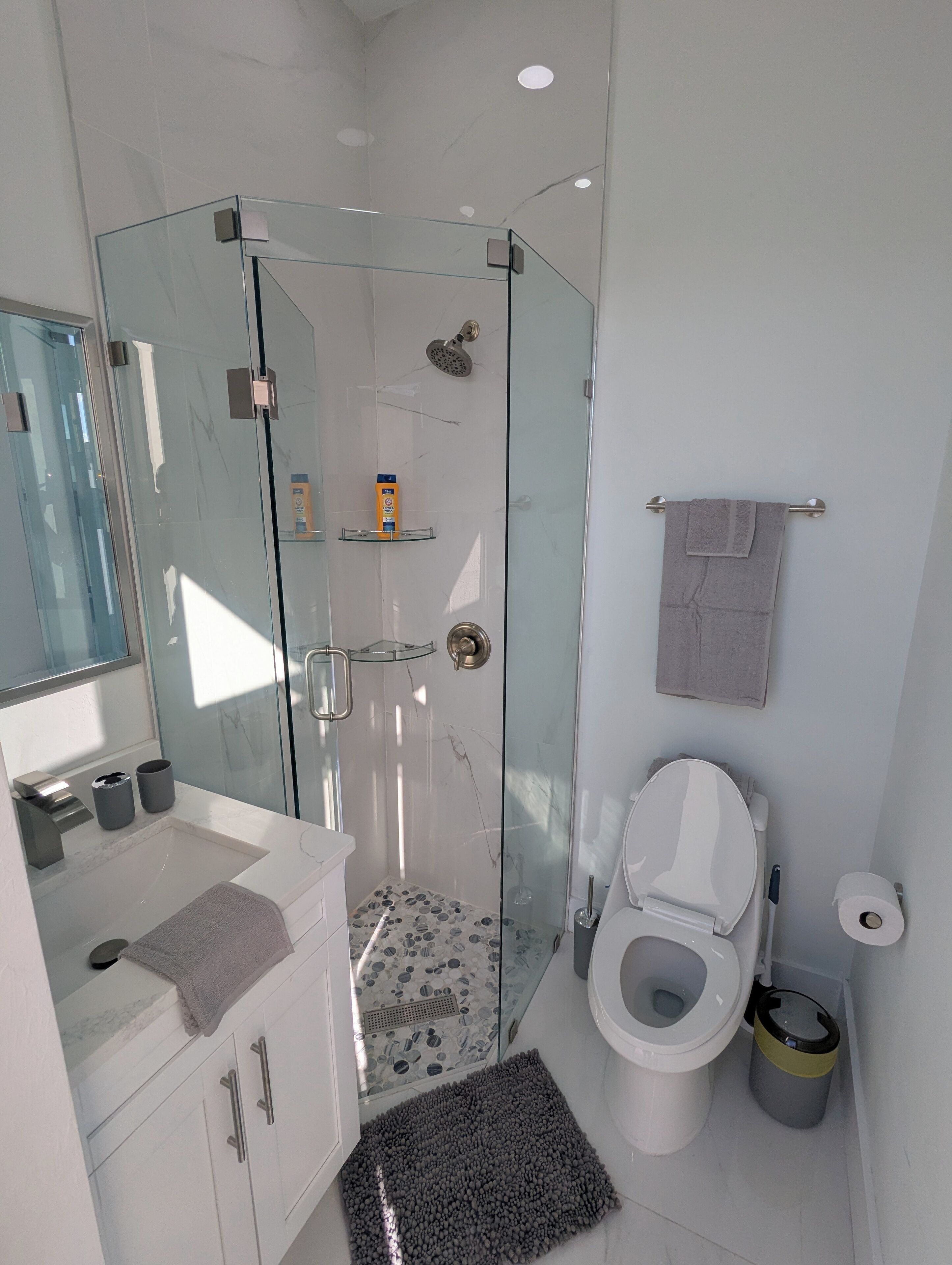 Shower, hair dryer, towels, soap