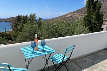 Side of large front balcony overlooking the beach and mountains. 