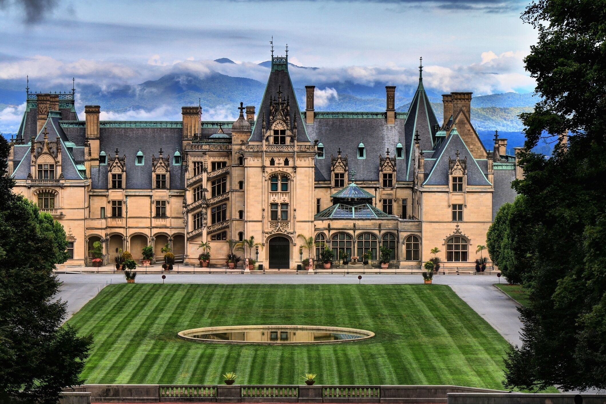 A grand historic building with a symmetrical facade, large windows, and a central entrance.