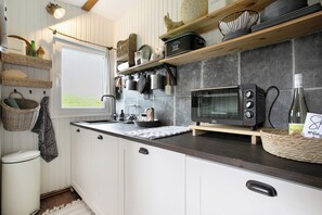 Fridge, microwave, stovetop, coffee/tea maker