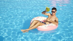 Outdoor pool, open 7:00 AM to 9:00 PM, sun loungers