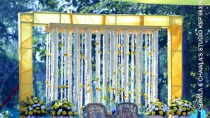 A decorated outdoor area with a pool, featuring a seating arrangement and floral decorations. - The Tattwaa Corbett Spa & Resort (Ramnagar)