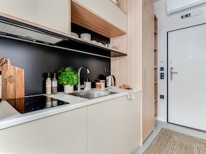 Fridge, stovetop, toaster, cookware/dishes/utensils
