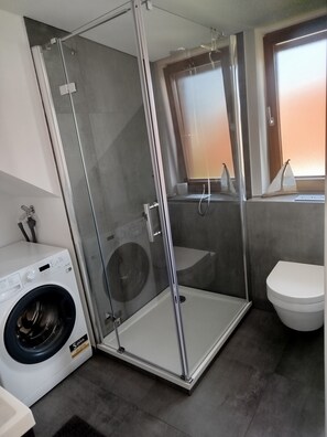 Shower, hair dryer, towels, soap