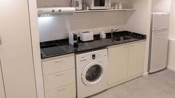 Coffee/tea maker, microwave, toaster, cookware/dishes/utensils