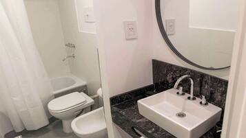 Shower, hair dryer, towels, shampoo
