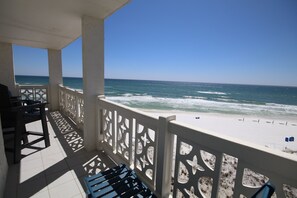 A balcony with a view of the ocean, featuring a white railing and a tiled floor. - 350 El Matador 2 Bedroom Condo by RedAwning (Fort Walton Beach)