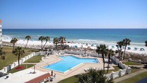 A pool area with a view of the beach and ocean. - 454 El Matador 1 Bedroom Condo by RedAwning (Fort Walton Beach)