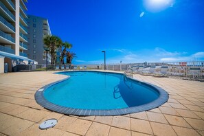 A swimming pool with a tiled deck, a metal ladder, and a 'No Diving Allowed' sign. - Surfside Shores 1804 2 Bedroom Condo (Gulf Shores)