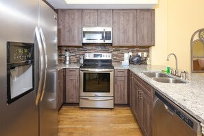 Condo, 2 Bedrooms | Private kitchen | Fridge, oven, coffee/tea maker