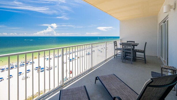 A balcony with a view of a beach and ocean. - Seawind 905 3 Bedroom Condo (Gulf Shores)