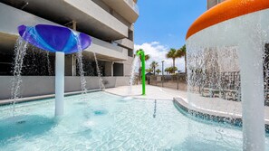 A swimming pool with water features, including a fountain and a water sculpture. - Seawind 905 3 Bedroom Condo (Gulf Shores)