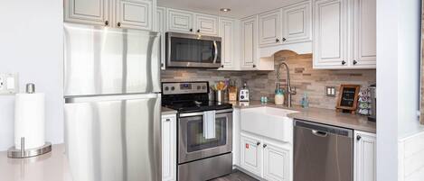 Condo, 3 Bedrooms | Private kitchen | Fridge, coffee/tea maker, dining tables