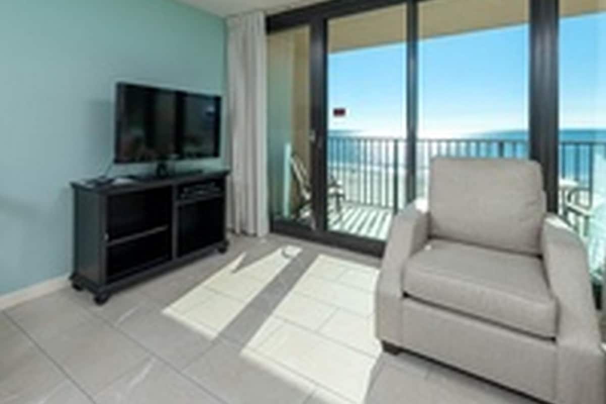 Estudio, 1 habitación | Área de sala de estar | Televisión de pantalla plana