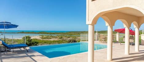 Outdoor pool, an infinity pool, sun loungers