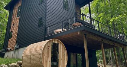 The Holiday House | Modern Wooded Retreat Near TC & Trails | Sauna