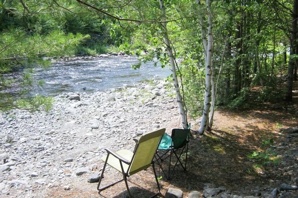 Just one of many places along 300' stream frontage to sit and relax
