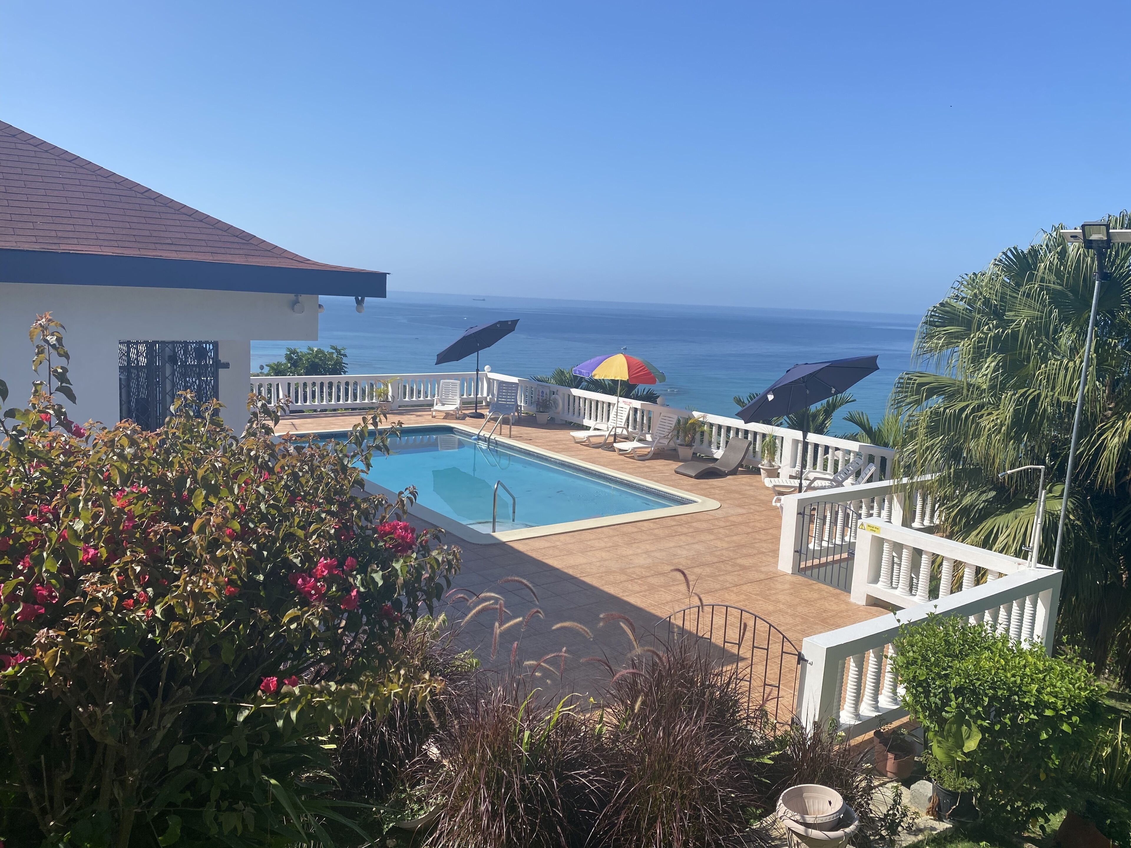 View of the Carribbean sea and pool from top entrance 