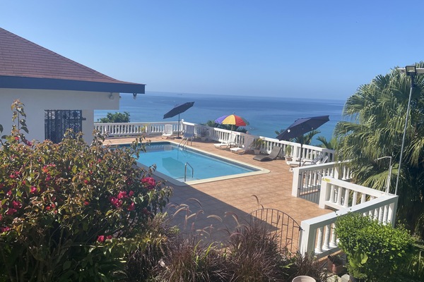 View of the Carribbean sea and pool from top entrance