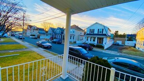 A residential street with houses and parked cars. - Bright, Stylish & Cozy Private Attic Unit near NYC (HALEDON)