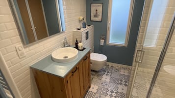 Shower, hair dryer, towels, soap