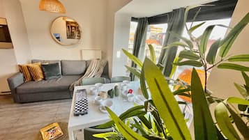 Apartment, 1 Bedroom | Living room | 45-inch flat-screen TV with digital channels