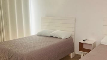 Laptop workspace, free WiFi, bed sheets