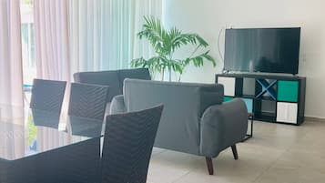 Villa | Living area | 32-inch Smart TV with satellite channels, TV