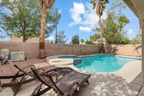 Outdoor pool, a heated pool - 3000 SqFt House 8beds/3bath W/Heated Pool/Spa/BBQ 86"SmartTV/Games Strip/Airport (Las Vegas)
