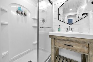 Shower, hair dryer, towels, soap