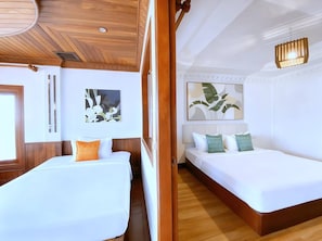 A hotel room with two beds, wooden ceiling, white walls, and artwork. - Angkor Land Urban Boutique (Siem Reap)