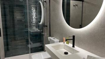 Shower, rainfall showerhead, designer toiletries, hair dryer