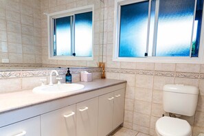 Bathtub, hair dryer, towels