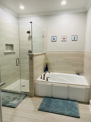Shower, hair dryer, towels, toilet paper